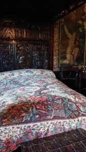 Colourful bedspread on a bed