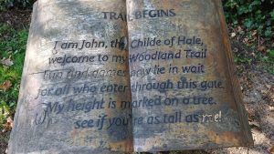 Large wooden book with carved text